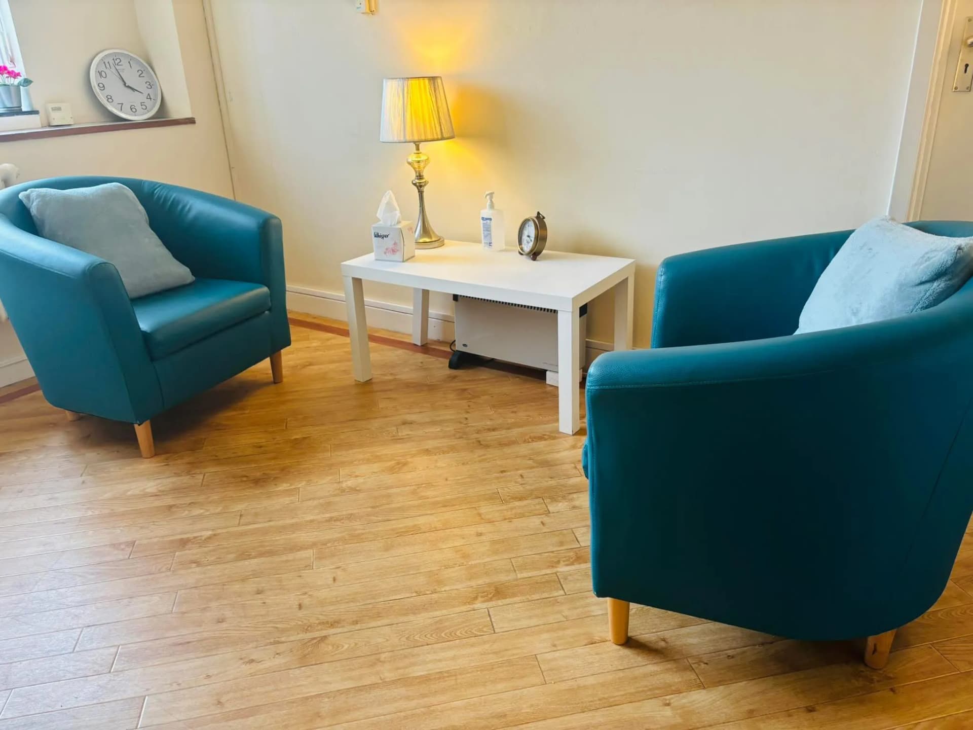 Claire's therapy room at Manor Drive Medical Centre, with two comfortable chairs facing each other